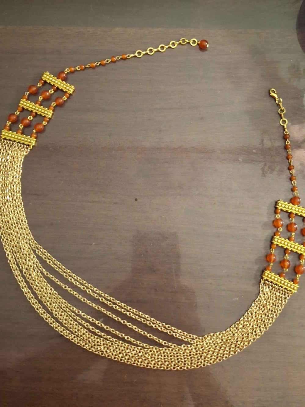 Gold Multi-Strand Necklace with Orange Bead Accents